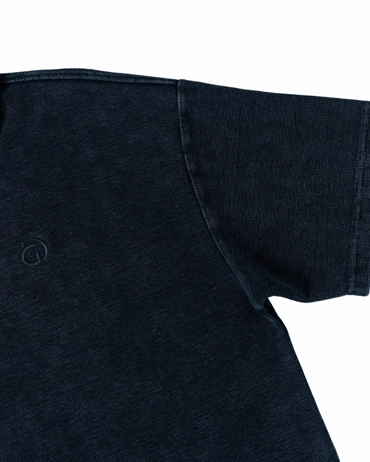 The Standard Zip Polo in Black, sleeve detail