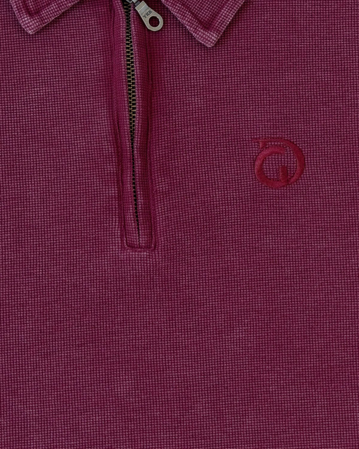 The Standard Zip Polo in Oxblood, detail of the zip placket and waffle fabric