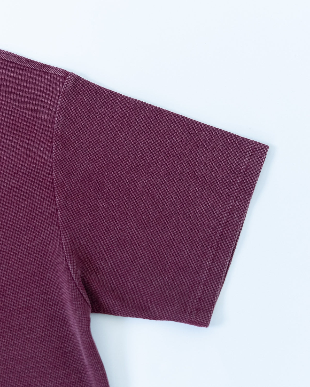 The Standard Zip Polo in Oxblood, sleeve detail
