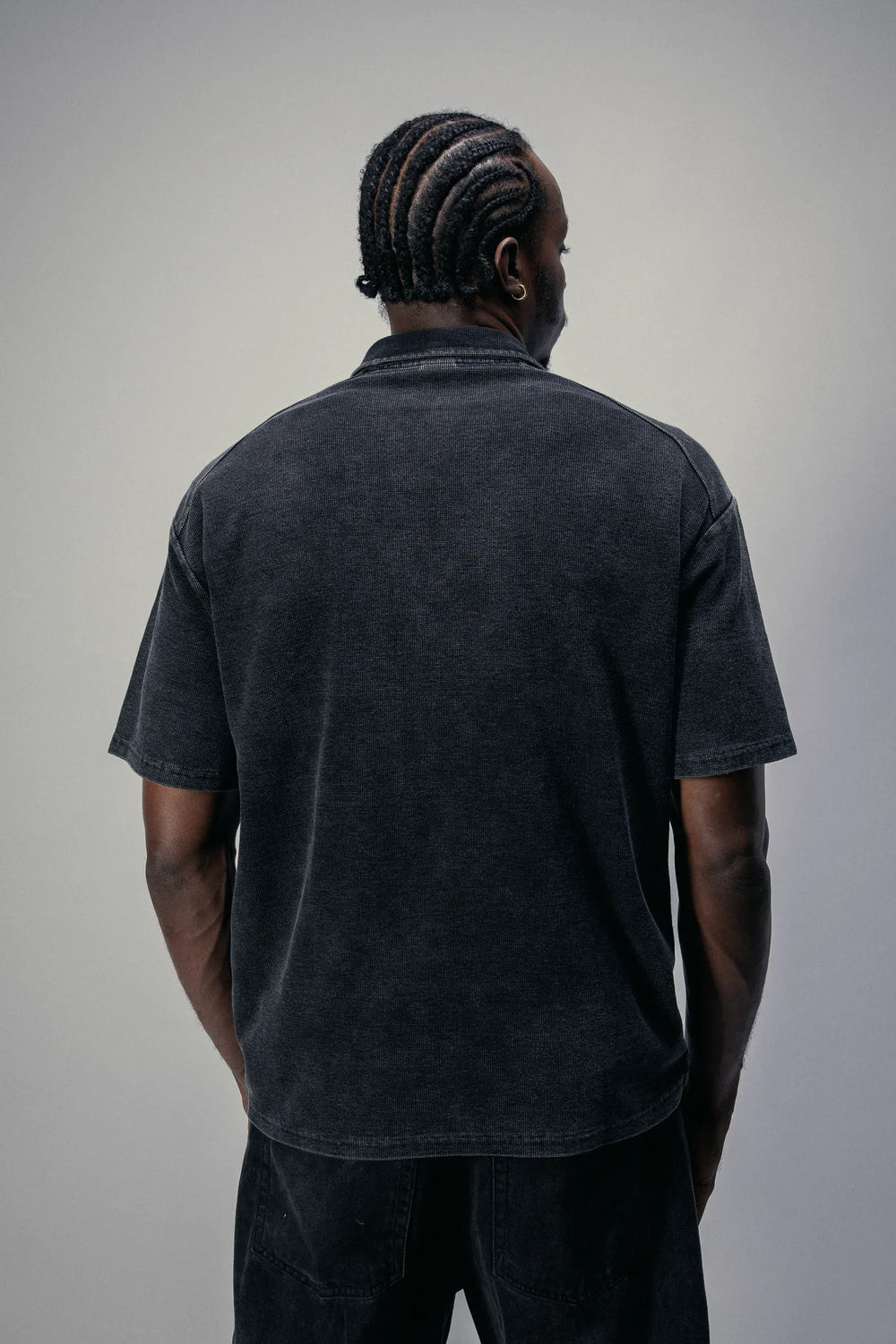Short-sleeve zip polo in Black, back