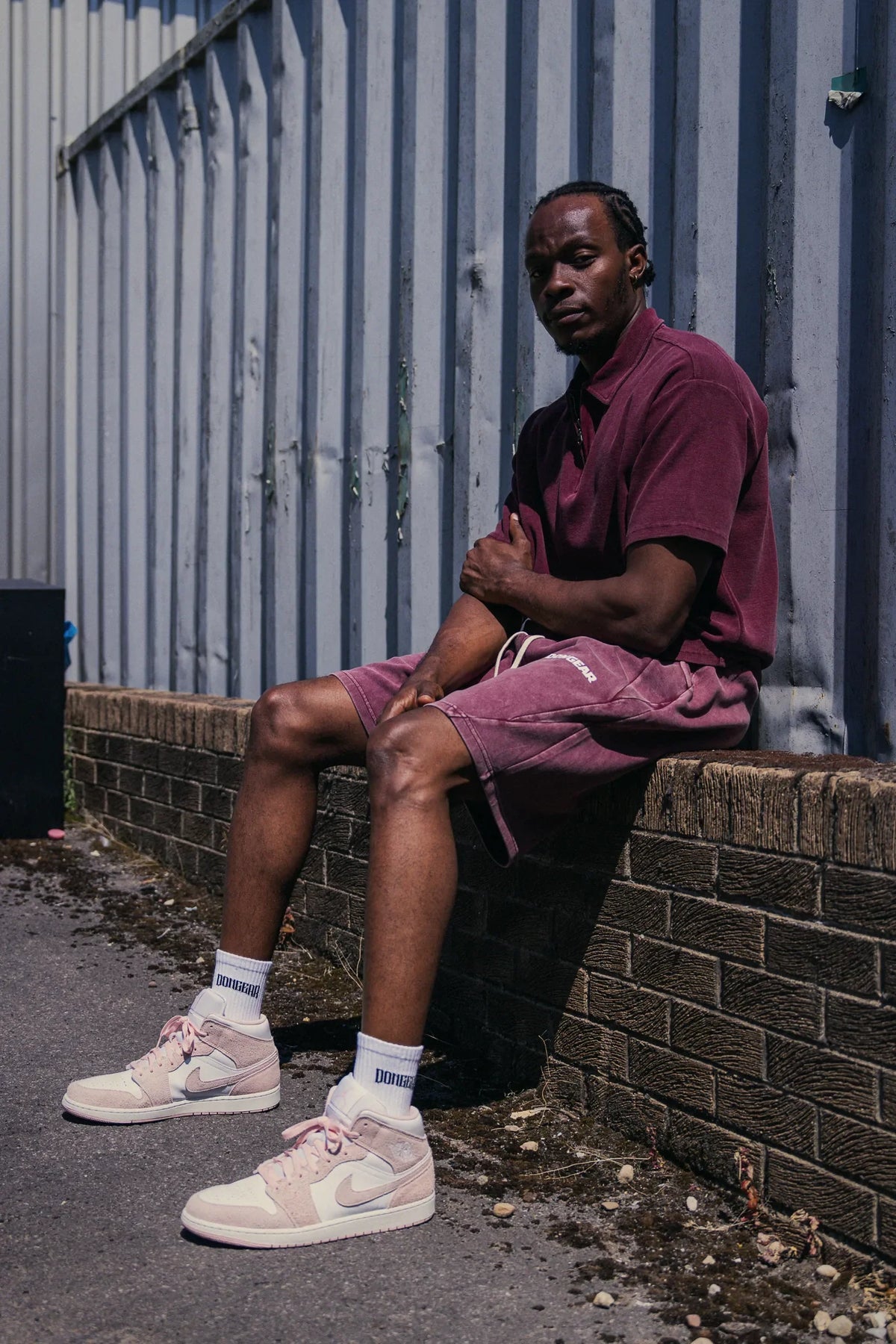 The Standard Shorts in Oxblood, worn with The Standard Zip Polo in Oxblood